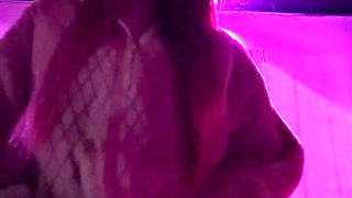 Smoking a Cigarette Outdoor While Wearing Only a Bikini and a Jacket