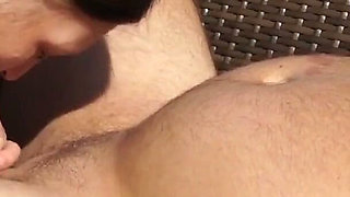 Mature woman giving a blowjob on the balcony