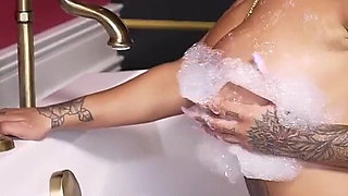 Busty Tattooed MILF Tyra Soaks in Her Wet Dreams