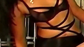 Brunette Dominatrix Teases Her Masked Caged Slave