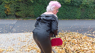 Naughty Granny Tongue Out Flashing Big Tits in Public
