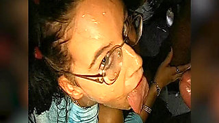 Bukkake Slut with Glasses Gets Her Face Drenched in Cum