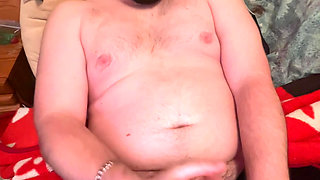Chubby boy jerks off in bed