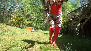 Sissy Crossdresser And Daisy Dukes - Exposed Giant Fake Tits Crossdresser In Corset And Running A Push Mower