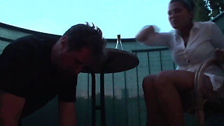 Sexy femdom smoking a cigarette while getting feet licked and toes sucked