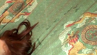 Watch redheaded milf sucks a cock and gets fucked on her husband's bed