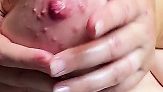 Rubbing Oil on My Huge Tits