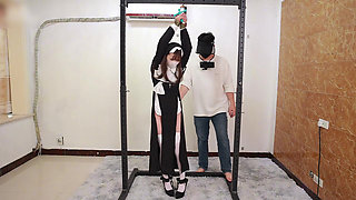 The Girlfriend Role-plays a Nun, Handcuffed and Shackled, Bound to an Iron Frame