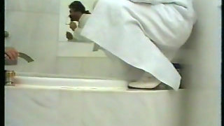 Alluring babe is getting pissed in the bathroom