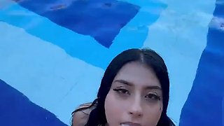 Flirting with a super hot busty Colombian outdoors in the pool