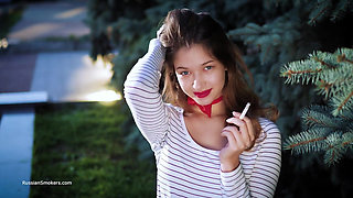 Sultry Russian Girl Smoking Cigarette by Waves