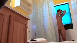 Stepdaughter 21 shaves pussy in shower (voyeur)