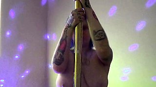 Tattooed Chubby Cutie Teases on the Strip Pole