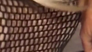 Mature Dominatrix Oversees Masked Man with Bound Blonde