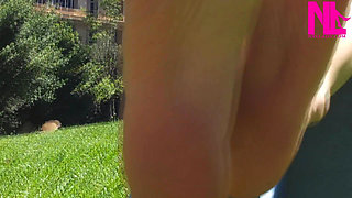 Nyllady Walking Barefoot on Th Grass in a Park