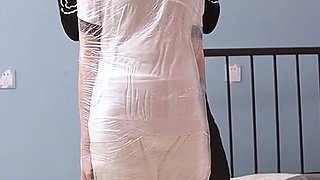 A Cute Barefoot Girlfriend Uses Tape to Bind Her Whole Body, Playing with Her Cute Bare Feet