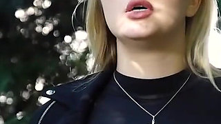Hot Blonde Babe Smoking Two Black Cigarettes in Nature